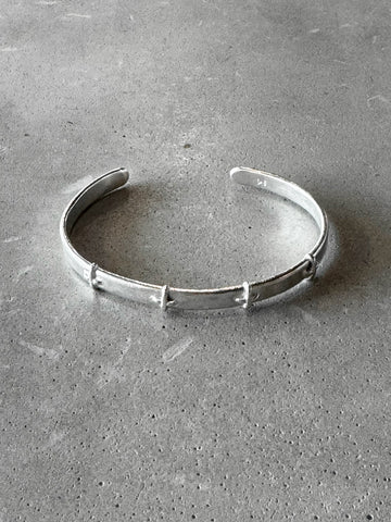 M.A+ Thin Silver Stitched Cross silver Bangle
