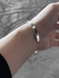 M.A+ Thin Silver Stitched Cross silver Bangle